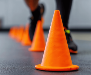black man engagin in coen drill at gym to demonstrate confidence in motion